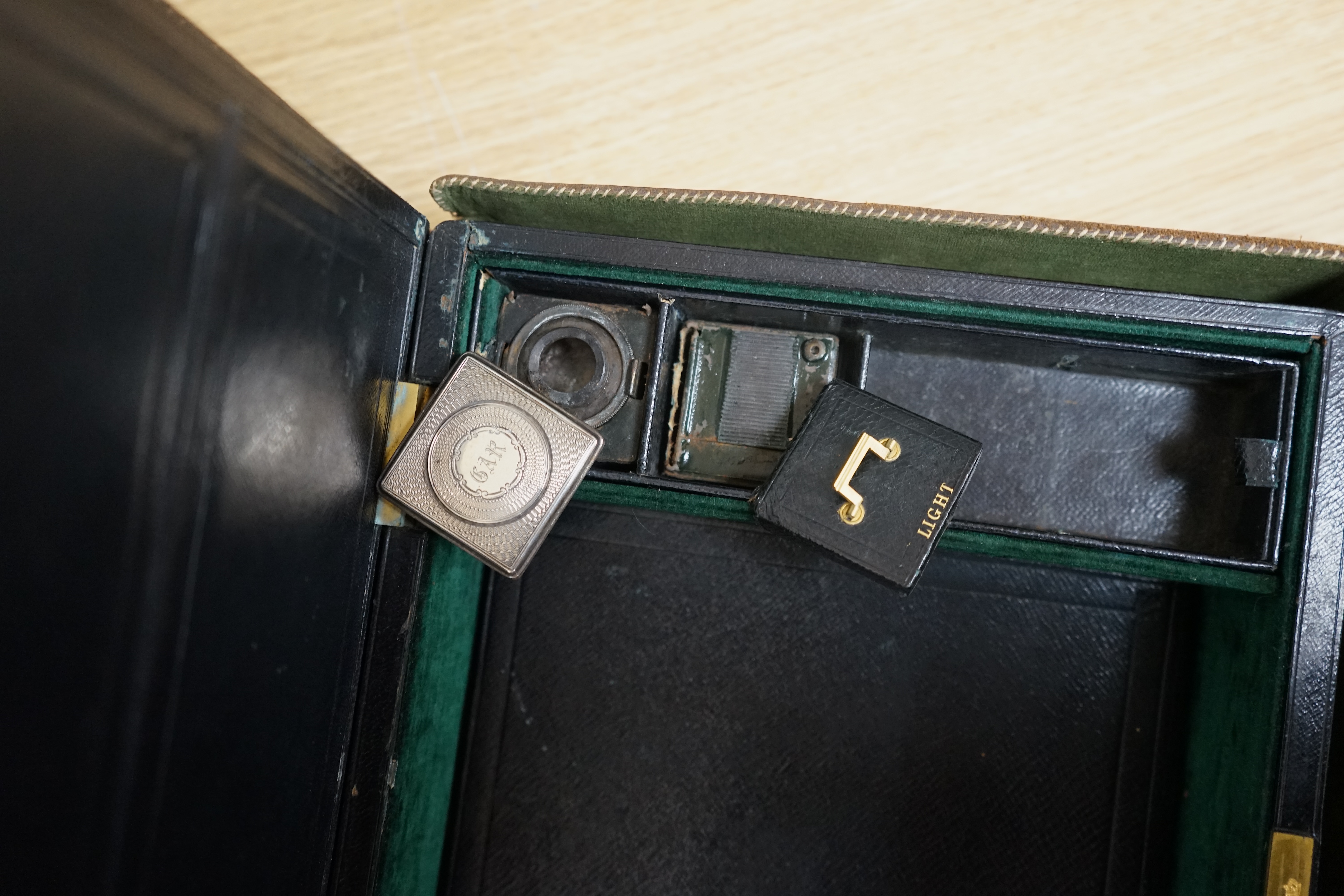 Wells & Lambert, London, a travelling writing box and outer leather case, with Bramah lock and keys, with monograms and inscriptions of Rev. George A. Robins, the box incorporating a silver lidded inkwell, 33cm wide. Con